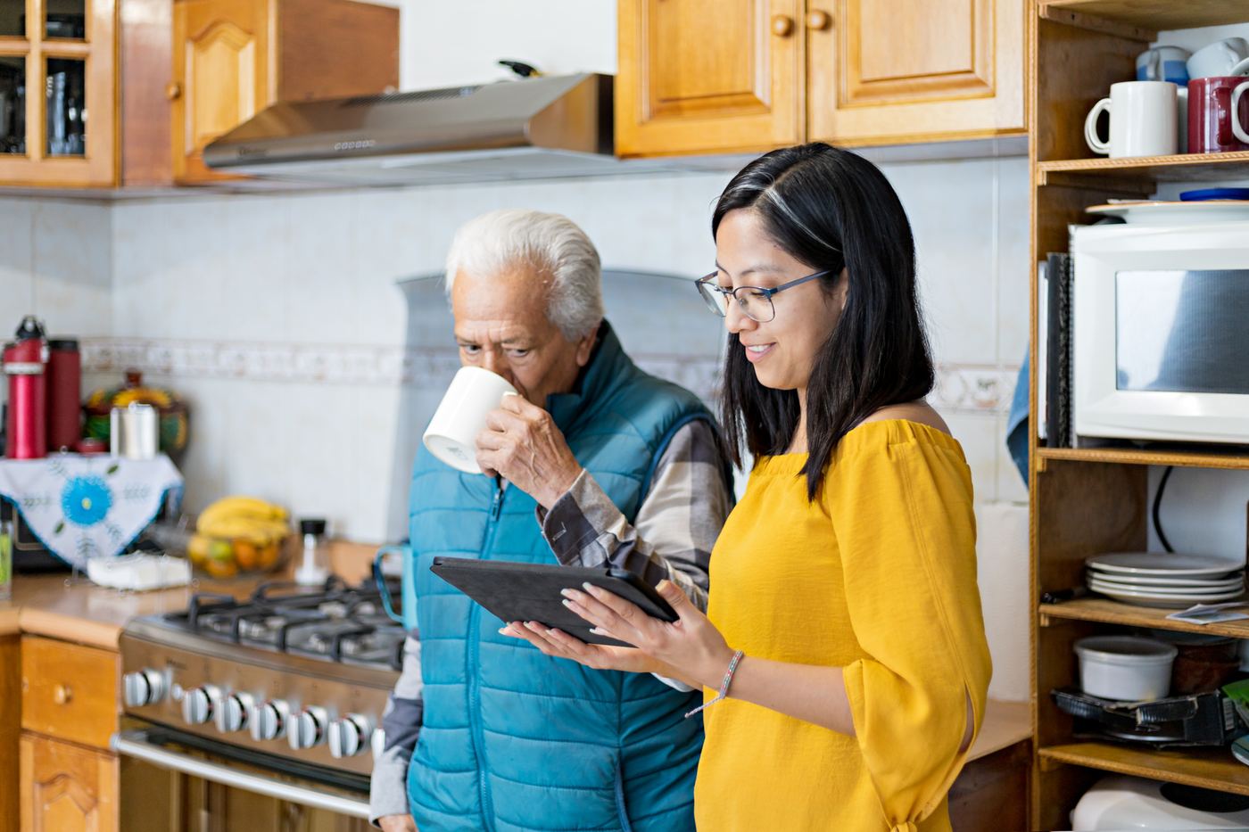 Family caregiver using the Maia app on a tablet
