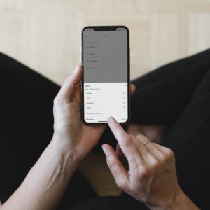 Caregiver reviewing an alert on a mobile phone